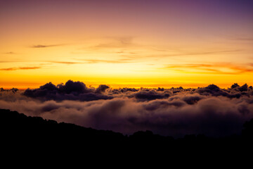 Morning sea fog at sunrise in the mountain, and the white fog and the orange sky