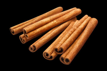 Wall Mural - Delicious cinnamon sticks, isolated on black background