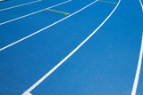 Fototapeta  - Treadmill for running in the stadium in blue