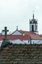 European Historical Church Steeple And Rooftop Cross