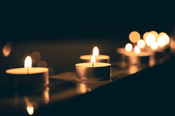 Wall Mural - Burning candles in the bathroom in the dark.