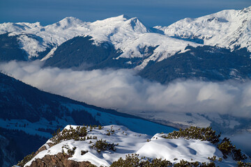 Wall Mural - beautiful view to the snow capped alps in austria at a sunny and cold winter day