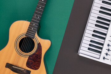 Wall Mural - Guitar and musical keyson a colored background, top view.