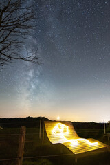 Wall Mural - LED Stick Figure under Milky Way