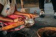 Close Up - Traditionelle Gewinnung von Shea Öl durch zerstampfen der Shea Nüsse mit einem Holzstößel, Oshana, Ovamboland, Namibia