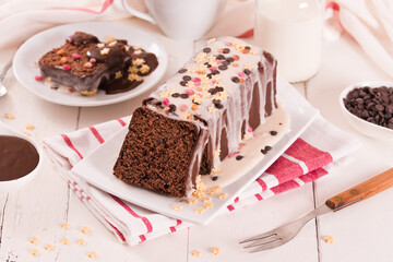 Wall Mural - Sponge cake with white frosting and sugars.