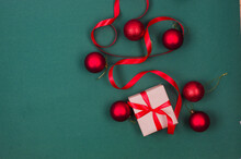 Christmas Background With Gift Boxes Red Baubles And Ribbon