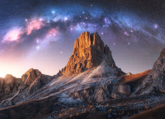 Wall Mural - milky way acrh over beautifull rocks at starry night in summer in dolomites, italy. landscape with p