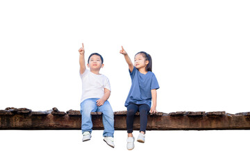 Children sitting on wooden bridge, Happy kids boy and girl having fun outdoor, brother and sister playing outdoors