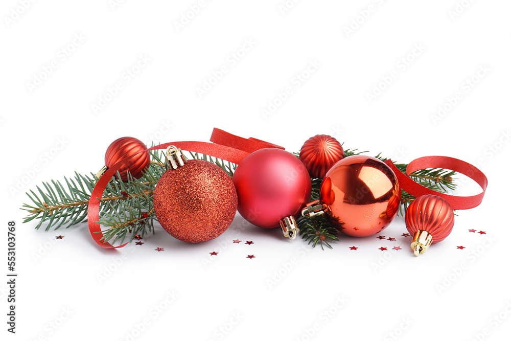 Beautiful Christmas balls and fir branches on white background