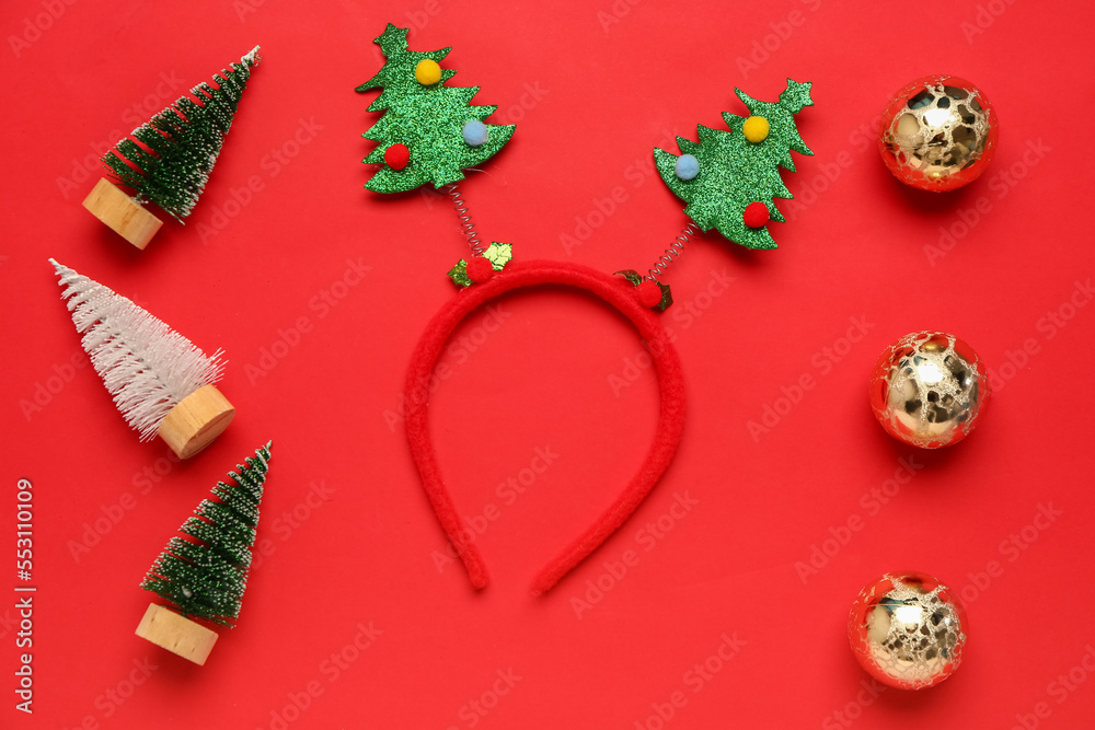 Funny Christmas headband and decorations on red background