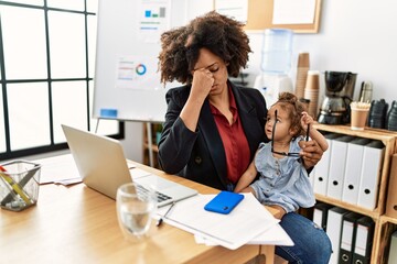 Poster - Young african american woman talking on the smartphone working with baby at office