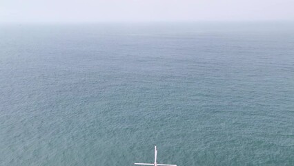 Poster - Drone panning backwards to reveal pier