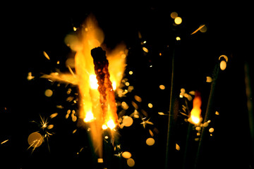 Wall Mural - blazing handheld firework as background