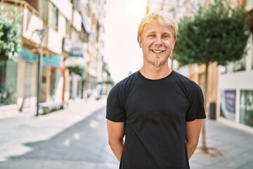 Sticker - Young caucasian man smiling confident at street