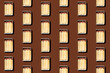© Westend61 - Pattern of rows of matchboxes flat laid against brown background