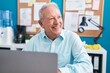 © Krakenimages.com - Middle age grey-haired man business worker using laptop working at office