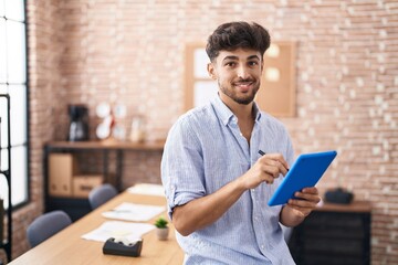 Sticker - Young arab man business worker writing on touchpad at office