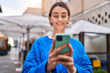 Poster - Young caucasian woman smiling confident using smartphone at coffee shop terrace