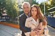 © Krakenimages.com - Middle age man and woman couple hugging each other standing with relaxed expression at park