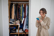 Cluttered Closet Woman Selling Used Clothes Online