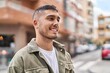 © Krakenimages.com - Young hispanic man smiling confident standing at street