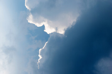 Wall Mural - bright sunlight in blue sky with clouds