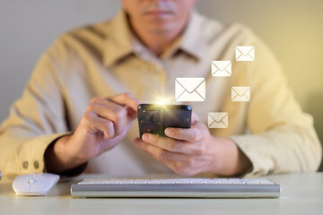 Poster - Businessman hands using smartphone on office table surfing the internet with email icon, email marketing concept, send e-mail or news letter, online working internet network