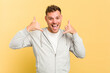 Young caucasian handsome man isolated on yellow background showing a mobile phone call gesture with fingers.