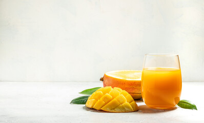 Wall Mural - mango juice and fresh fruits on a light background. Long banner format