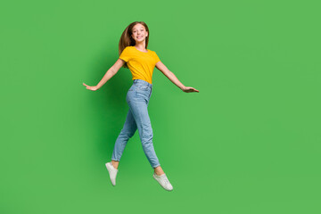 Sticker - Full body portrait of overjoyed adorable person jumping have good mood isolated on green color background