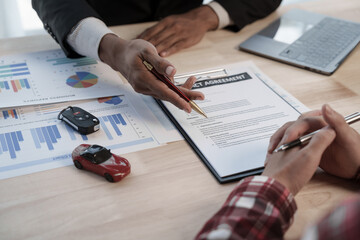 Wall Mural - Loan approver, businessman in suit, man giving car keys after car loan approval and contract signing