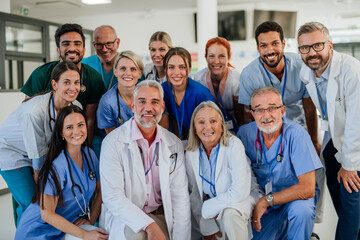 Portrait of happy doctors, nurses and other medical staff in hospital.