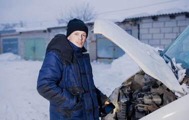 Wall Mural - truck van car driver fixing the car in winter on the road. Delivery car breakdown in winter