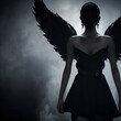 A dark woman with wings. Black angel woman. Satanic woman as an angel. Gothic girl.
