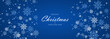 © Biod - Merry christmas and new year wide festive background with snow and swirling snowflakes on wide blue background. Vector illustration
