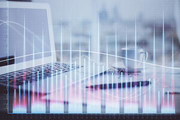  Forex graph hologram on table with computer background. Double exposure. Concept of financial markets.