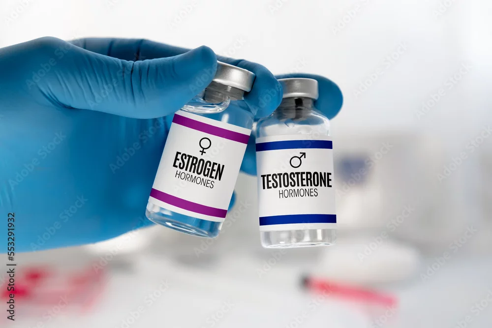 Gloved hand holding vials labeled estrogen and testosterone — stock illustration of hormone care