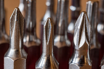 Set of bits for a screwdriver. Metal bits close up.