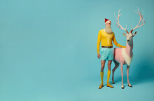 Fashionably Santa Urban Hipster Man In Trendy Casual Pastel Yellow Suit With Pink Reindeer On Pastel Blue Background. Elegant Minimal Illustration. Generative AI.