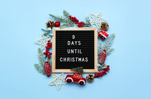 Black Felt Letterboard With Countdown Surrounded By Winter Decoration On Blue Background. 9 Days Until Christmas. Twenty-four Day Series Of Postcards. Selective Focus