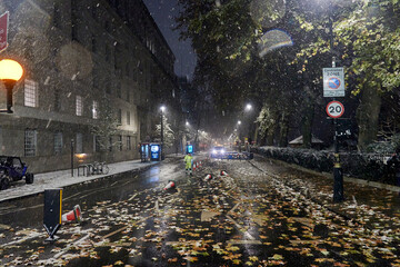 London in snow at night in December 