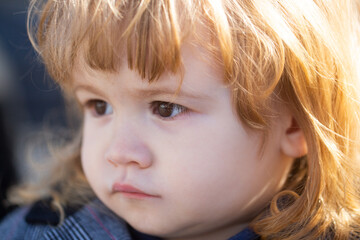 Funny baby child face close up. Kids head portrait.