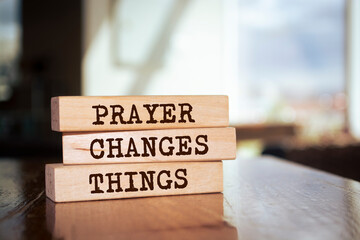 Wooden blocks with words 'Prayer Changes Things'.