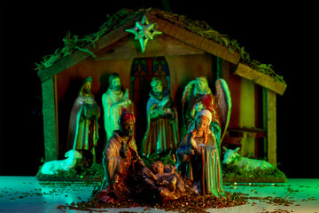 A Christmas scene with baby Jesus, Mary and Joseph in the manger. Bethlehem. Christian religious. The Blessed Virgin Mary, Saint Joseph and baby Jesus.