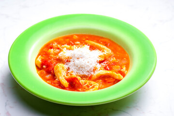 Wall Mural - tripe and tomato soup with parmesan cheese