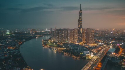 Wall Mural - Aerial hyper lapse of Landmark 81 skyscraper and Ho Chi Minh city skyline in sunset to night and moving traffic on street. Landscape and business concept