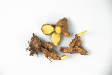 Turmeric, Ginger, And Laotian Spices And Herbs On A White Background