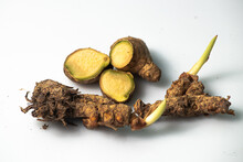 Turmeric, Ginger, And Laotian Spices And Herbs On A White Background