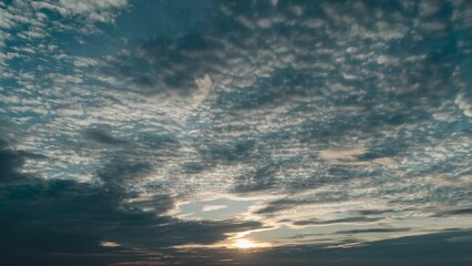 Wall Mural - 4K Sky Time lapse, Beautiful background, Sky Timelapse of skyscrapers, Blue sky with clouds and sun, Clouds At Sunset.